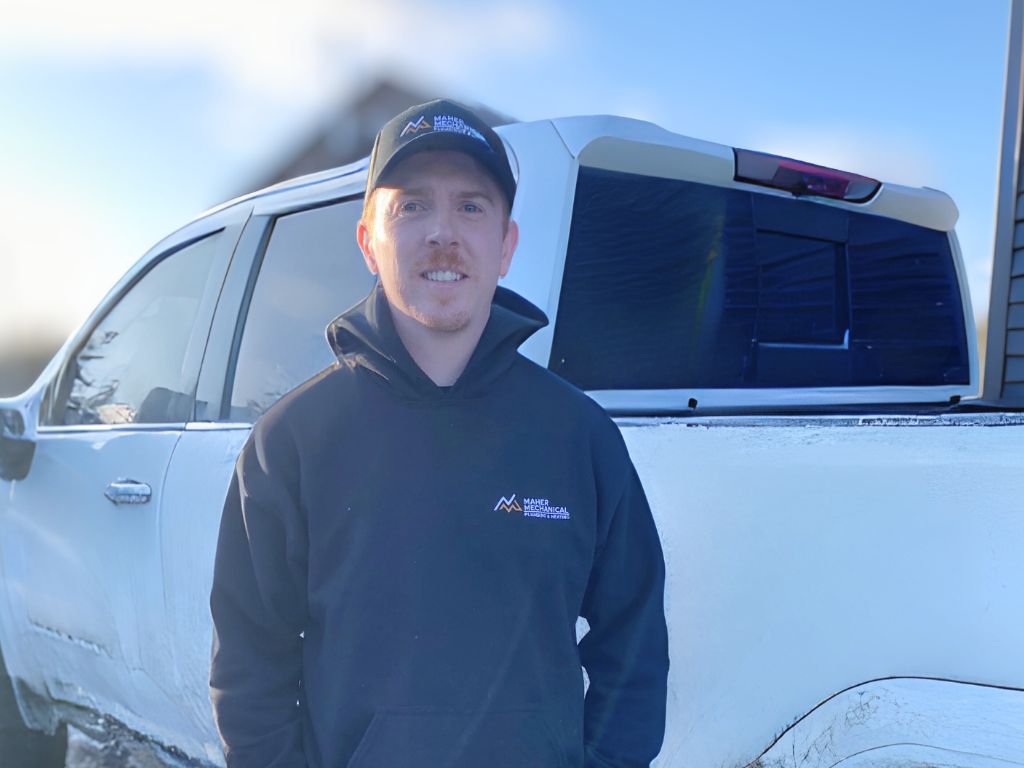 Jason Maher, Red Seal owner-operator of Maher Mechanical Ltd., standing in front of a service truck in St. John’s, Newfoundland.